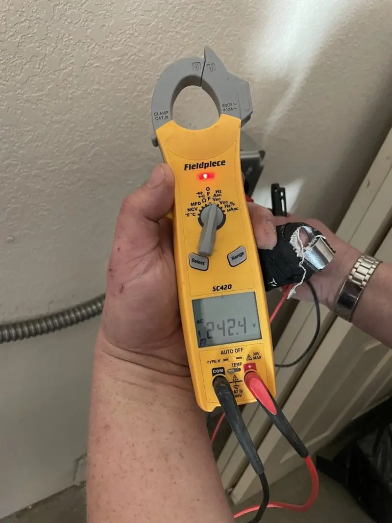 Voltage testing with clamp meter during Electrical Installation Services in Draper